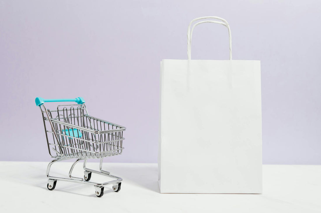 Shopping cart and plain white paper bag