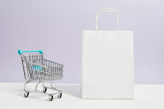 Shopping cart and plain white paper bag