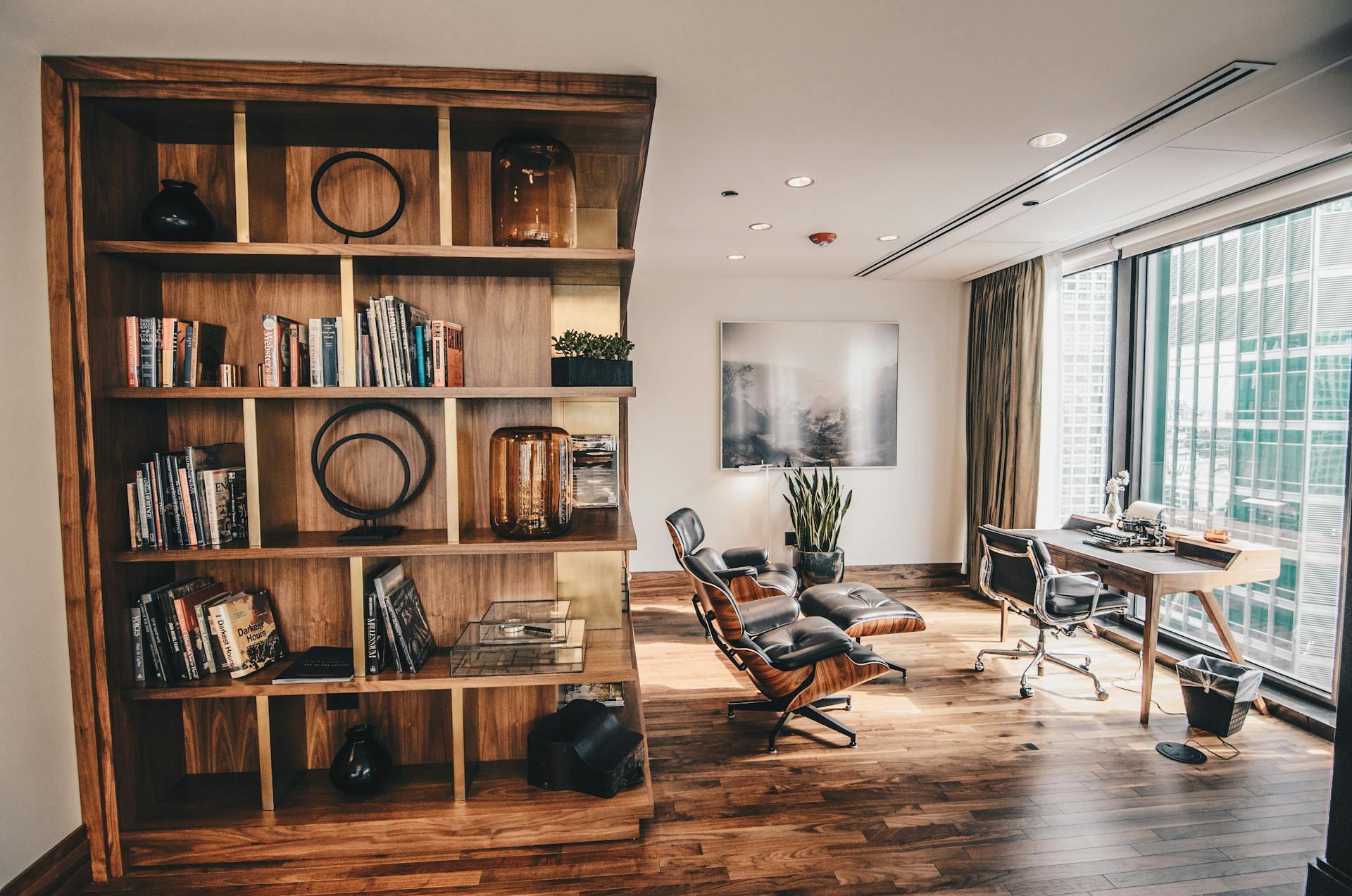 Beautiful Office with Wooden Flooring and Big Glass Windows Overlooking Office Buildings